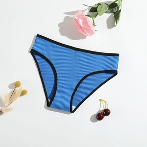 Royal blue ribbed cotton panties with black trim shown in a flat lay minimalist display