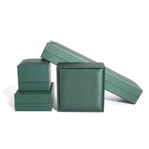 Luxurious dark green satin jewelry box set for rings, necklaces, and bracelets