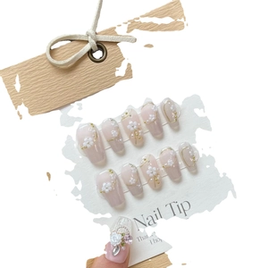 Handmade cat eye press-on nails set with 3D floral accents and pearls in soft pink