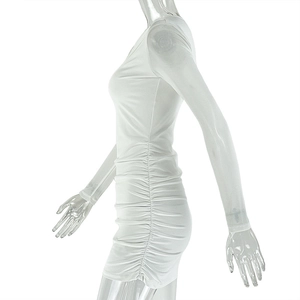 Detail of white slim fit mini dress featuring side ruching and asymmetrical floral design