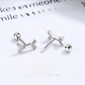 Macro detail of S925 silver tulip earrings featuring clear zircon stones and screw back