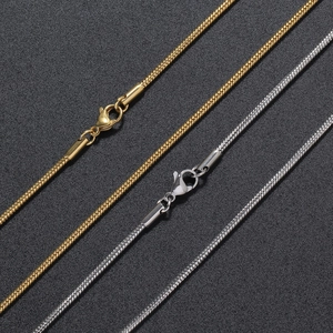 Close-up of 2mm gold and silver stainless steel snake chains with lobster clasps