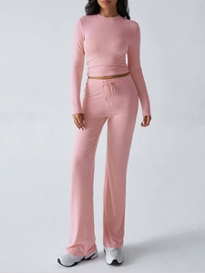 Pink long sleeve crop top and high waist drawstring trousers set for yoga and lounging