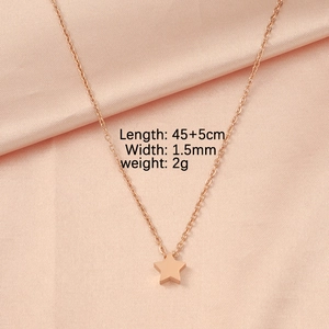 Macro shot of rose gold star pendant necklace with dimensions 45+5cm and 2g weight