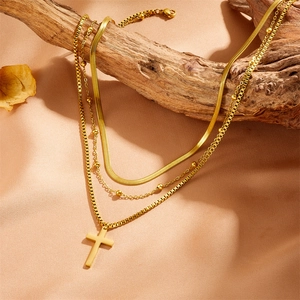 Gold layered stainless steel cross necklace with snake chain and bead chain display