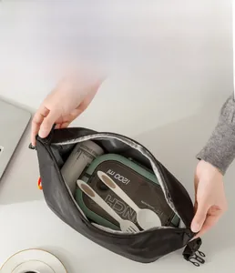 Spacious black nylon lunch bag showing 1200ml bento box and thermal bottle capacity