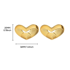 Macro view of gold heart earrings showing ripple texture and size dimensions