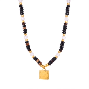 Bohemian beaded necklace featuring natural stones and a golden heart square pendant