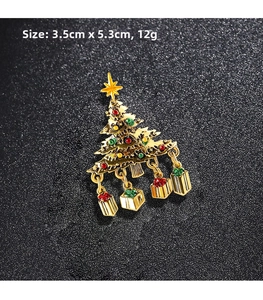 Detail of Christmas tree brooch with enamel finish and hanging gift charms, 3.5cm x 5.3cm