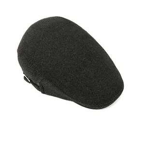 Top view showing the classic dark grey herringbone texture of the British flat cap