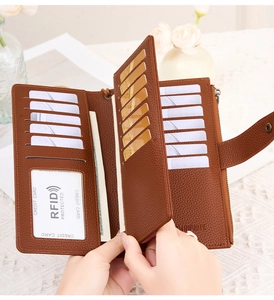 Close-up of brown litchi pattern wallet interior showing card slots and RFID protection