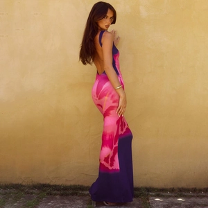 Detail of a backless floral maxi dress featuring deep purple and rose red print patterns