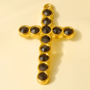 Detailed view of a gold 304 stainless steel cross pendant with black rhinestones