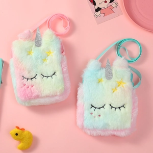 Detail of plush rainbow unicorn shoulder bags with glitter horn and star patches