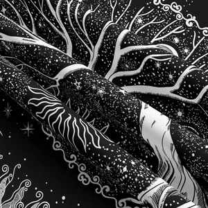 Detailed view of Tree of Life tapestry fabric with celestial sun and stars pattern