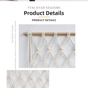 Detail of bohemian handmade woven wall hanging featuring cotton rope tassels and wooden beads