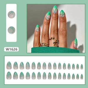 Green wavy press-on nails with glitter lines and almond shape gradient design