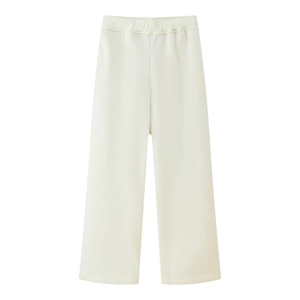 Detail of cream-white wide-leg lounge pants showing soft drape and high-quality fabric texture