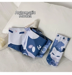 Detail of automatic folding umbrella with cute cartoon cat patterns and storage bag