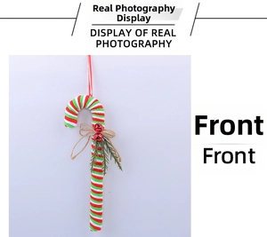 Close-up of candy cane ornament with red and green stripes, bow, and small bells