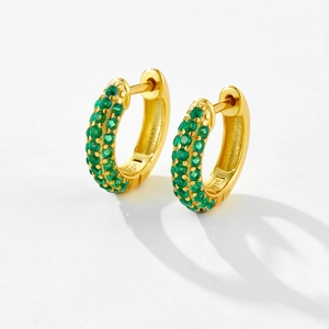 Close-up of S925 sterling silver gold hoop earrings with three rows of green zircons