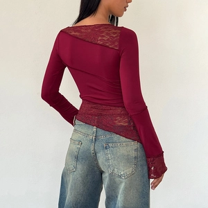 Detail of the sheer lace patchwork on the back of this slim dark red long sleeve top