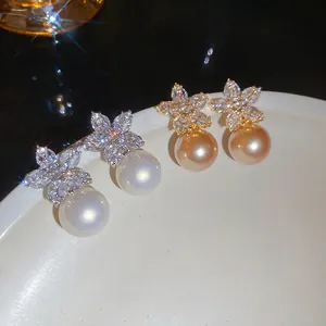 Elegant flower stud earrings with marquise crystals and large hanging pearls in two colors