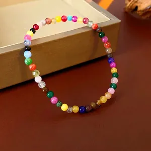 Colorful beaded bracelet with natural stone round beads on a luxury jewelry box display
