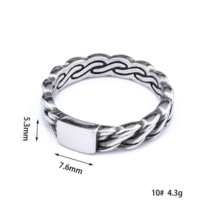 Detail shot of vintage punk style silver ring with flame texture and dimensions