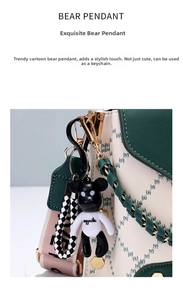 Detail view of cartoon bear charm on leather bag with stylish checkerboard strap
