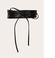 Detail of a black wide wrap-around belt with long ties and a decorative bow tie closure