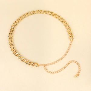 Detailed macro view of chunky gold chain link belt with adjustable lobster clasp and bead