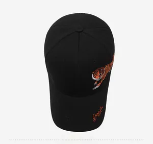 Top view of black baseball cap with detailed orange tiger embroidery on side