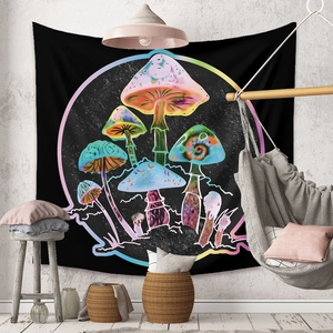 Detail of psychedelic mushroom tapestry on wall in a cozy boho living room setting