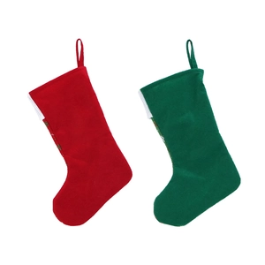 Detail of red and green felt Christmas stockings with white cuffs and hanging loops