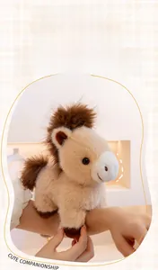 Cute beige pony plush toy worn on wrist as a snap bracelet with brown faux fur mane