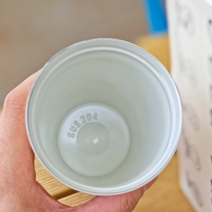 Close-up of the internal SUS 304 stainless steel lining inside the coffee cup