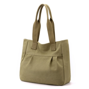 Minimalist khaki canvas tote bag with pleated design in a 45-degree side view profile