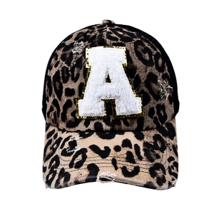 Detail of leopard print baseball cap with chenille letter A and distressed finish