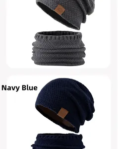 Close-up of navy blue winter knit set showing dense fabric texture and sport leather label