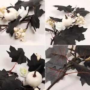 Detail showing black maple leaves, white pumpkins, and roses for Gothic holiday decor