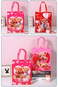 Detailed view of pink non-woven gift bags with cute bears and Valentine's Day motifs