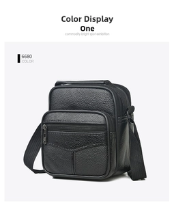 Close-up of litchi textured black leather crossbody bag with front zipper and nylon strap