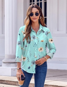 Detail of mint green long sleeve shirt with blue floral print and classic lapel collar