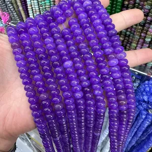 Close-up of translucent purple abacus beads made of natural stone for DIY jewelry
