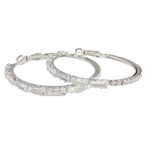 Silver C-shape hoop earrings featuring cubic zirconia pavé in a professional studio shot