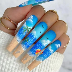 Extra long coffin press-on nails featuring hand-painted Hawaiian beach and palm tree summer art