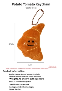 Detail view of croissant plush keychain measuring 8.5cm x 6cm with size markers