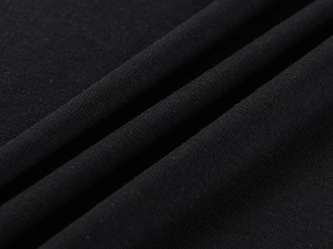 Macro shot of high-quality black tencel wool fabric texture with soft drape and fine weave