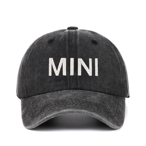 Close-up of MINI white embroidery on vintage washed black cotton baseball cap for kids